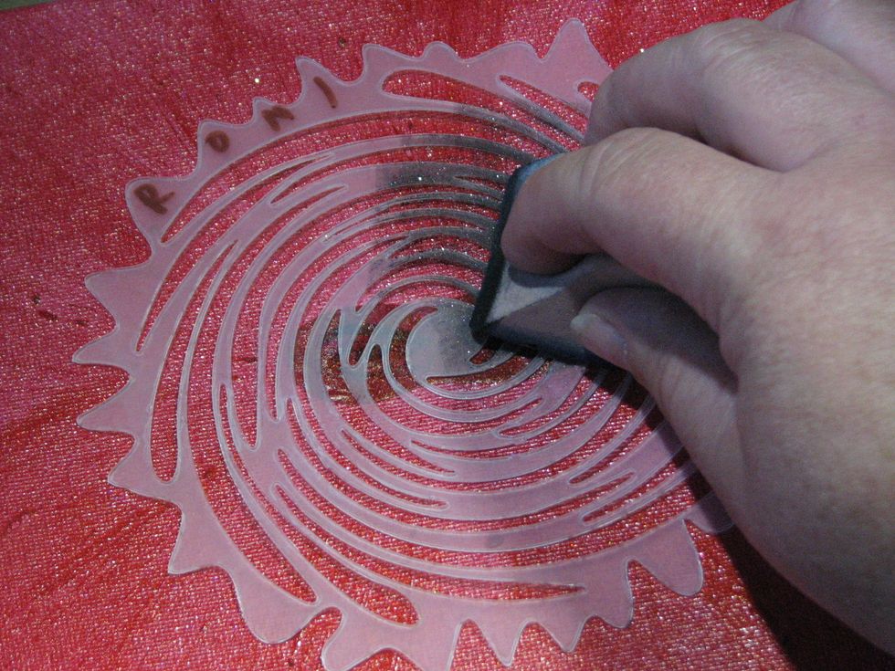 and begin applying it to the canvas over the mask.