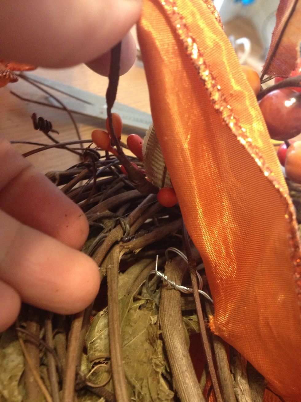And bend onto one of the twigs. This is good if you want to remove the sign or change it.