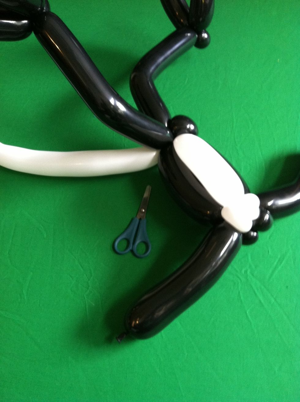 And bring down to bottom, wrap around a few times and cut off excess after making sure its secure