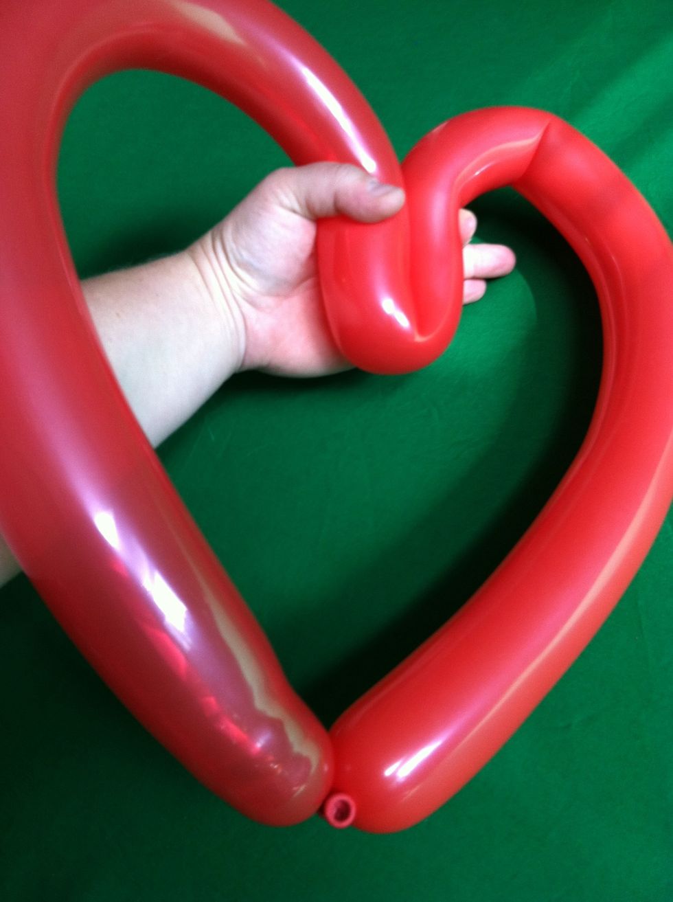 And bring the center of the balloon into itself and squeeze