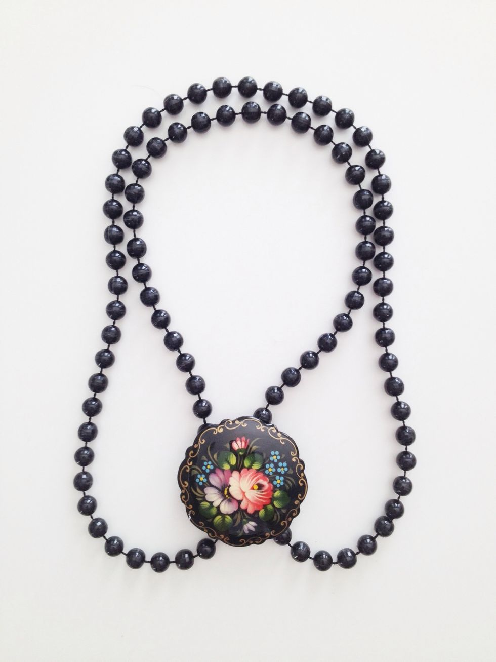 ...and clip both strands of beads together with your brooch!