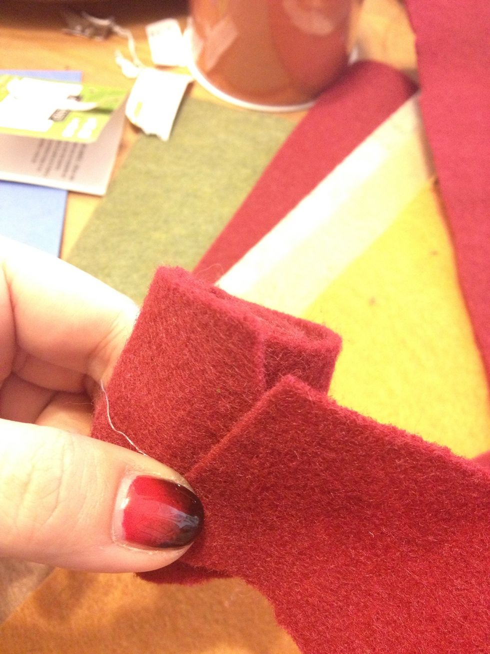 And continue the flower. Dabb some glue at the end to hold the edge in place .