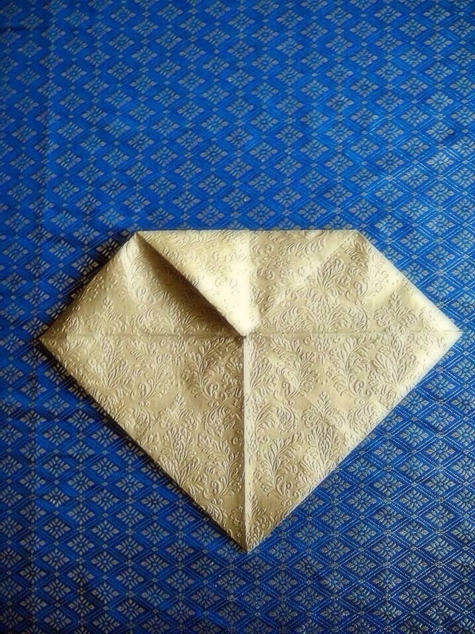 And do the same - fold all corners inside to make even smaller square