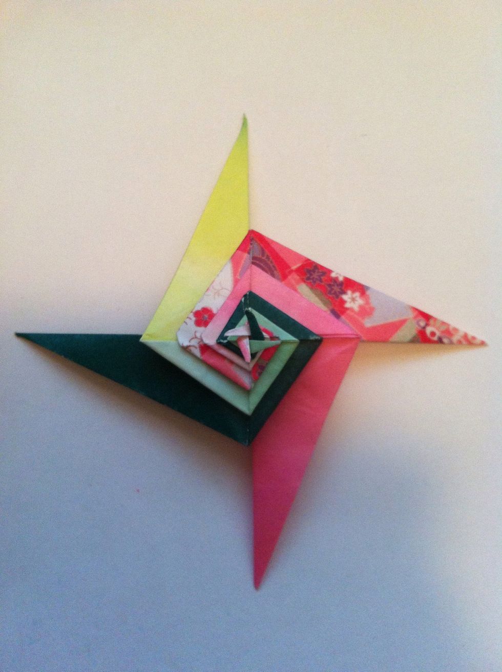 And done. You can either twist the little points, leave as is, or glue down. Ah, but wait. What if you flip it over & do the exact same thing on the other side?...