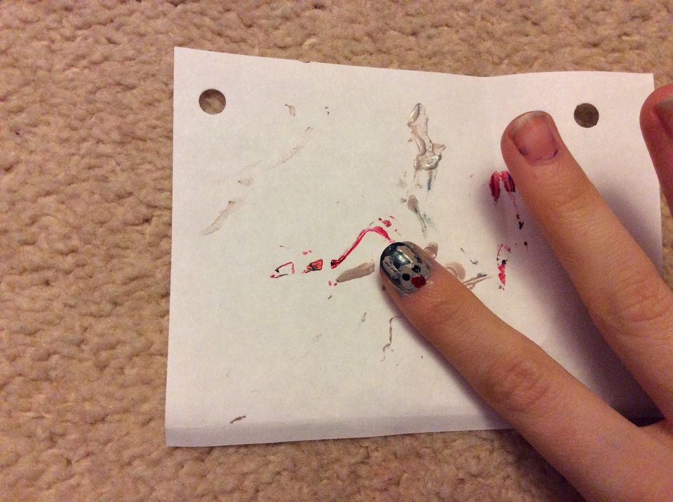 And draw two dots in black for the eyes and one dot in red for the nose.