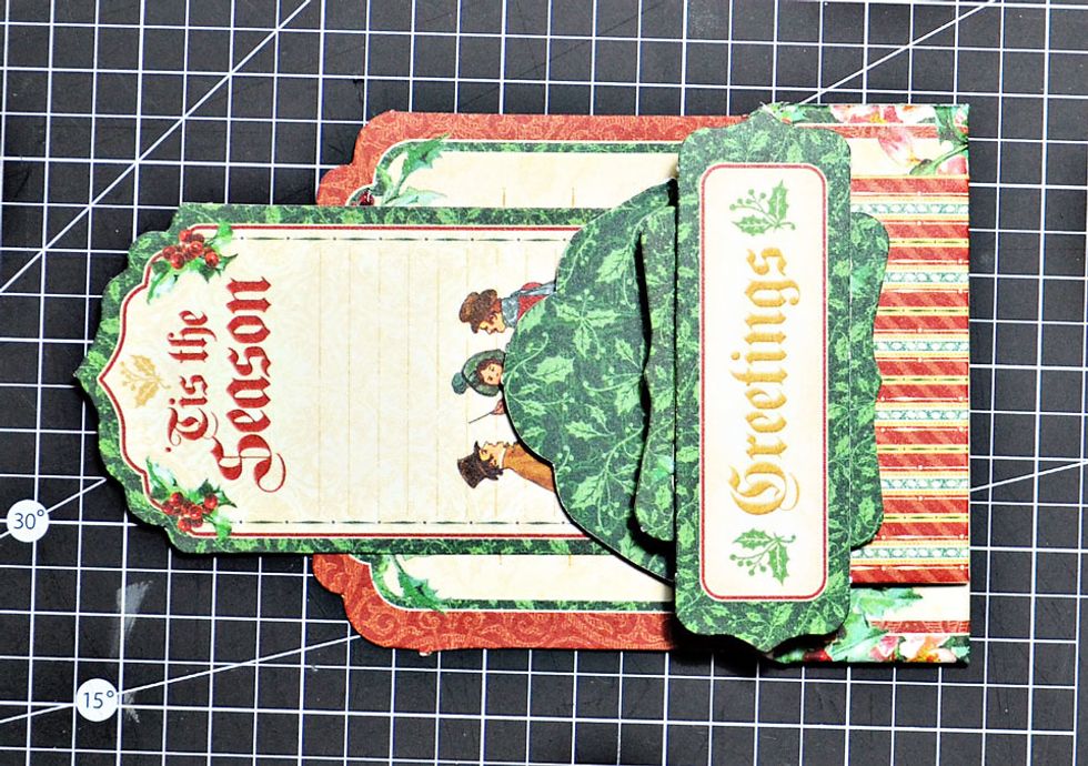 And finally add the final tag to the top. The gift card pocket is now finished and quiet dimensional, just the way I like it.