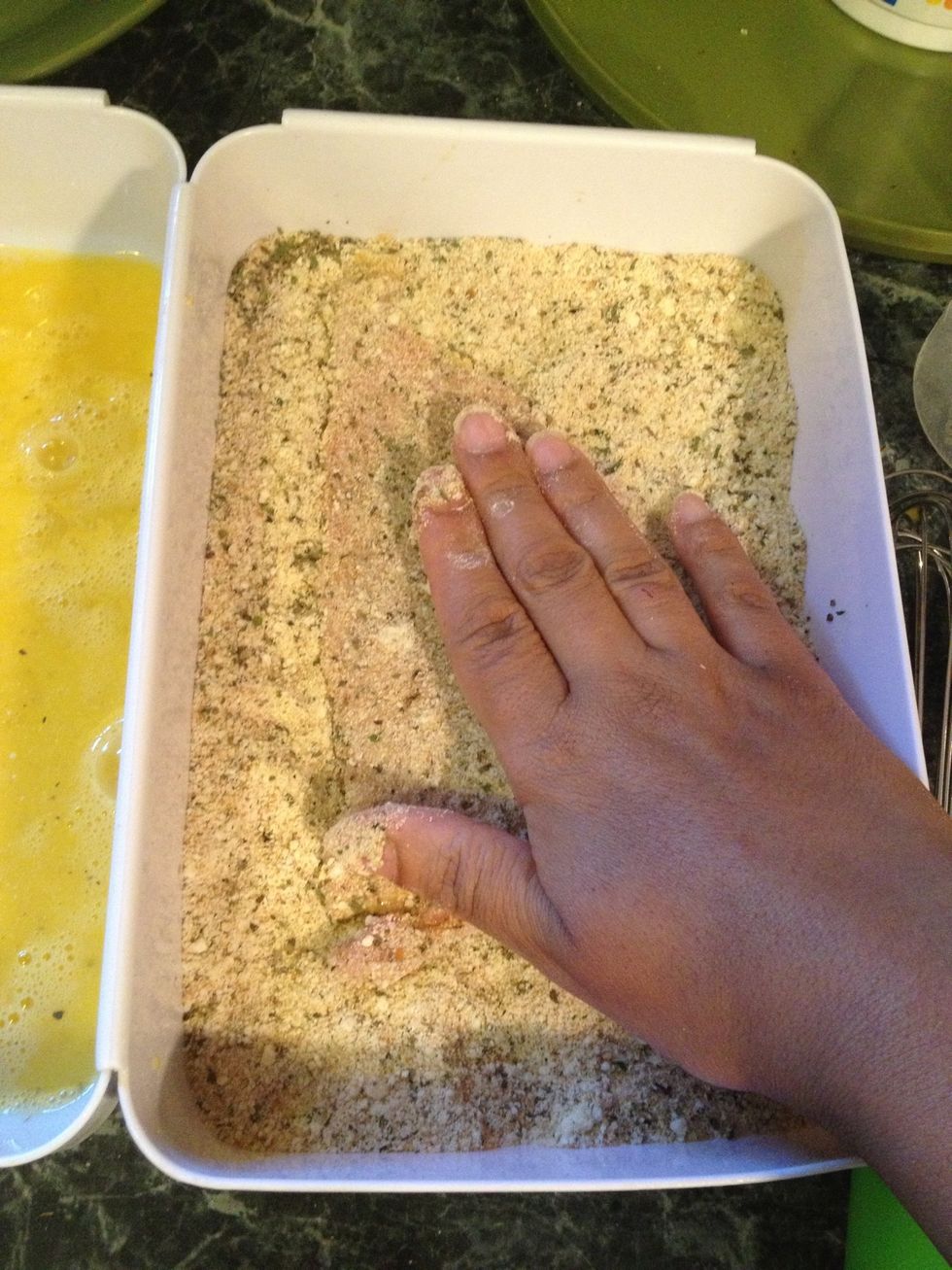 And finish off in the bread crumbs. Press each side of the veal gently on to the bread crumbs to make sure each cutlet gets a nice coating of breading.