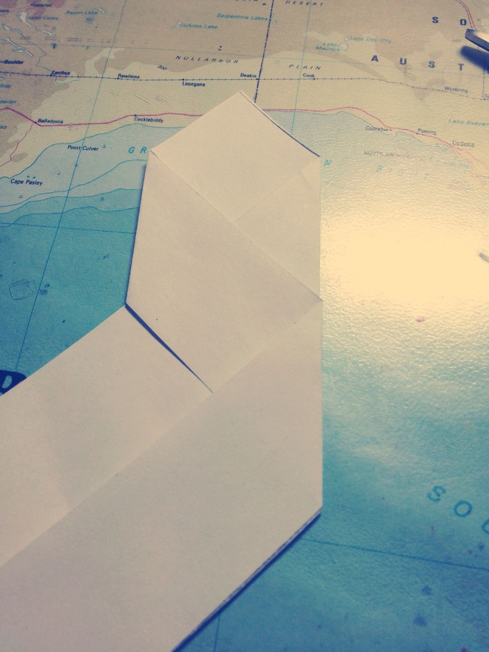 And fold it back to become parallel with the other strip.