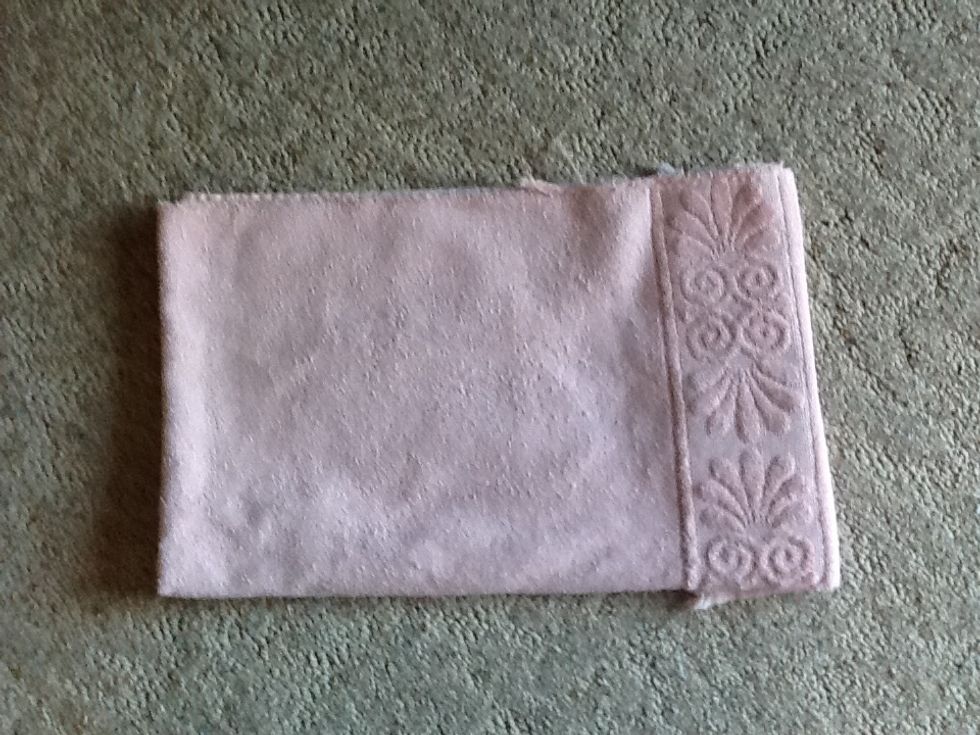 ... and fold it so that it fits neatly into the bottom of your dog's kennel.