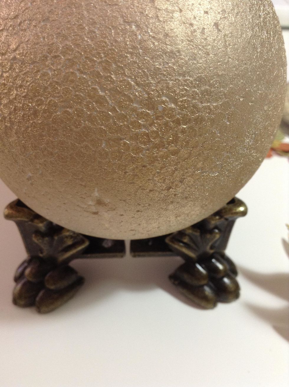 And glue two Graphic 45 Antique Brass Claw Feet to the ball.