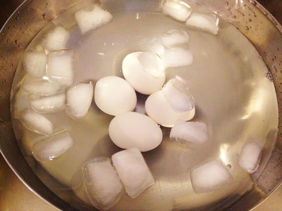 And go ahead and transfer the eggs to an ice bath to stop the eggs from cooking further. Let sit for about 10 minutes before peeling. Peeling should be easy from the ice bath and the salted water.