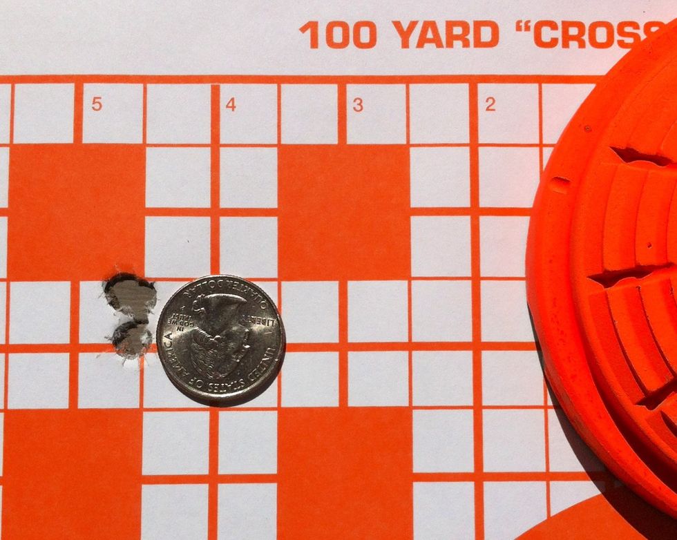 ...and here's the result. Three touching bullet holes at 100m