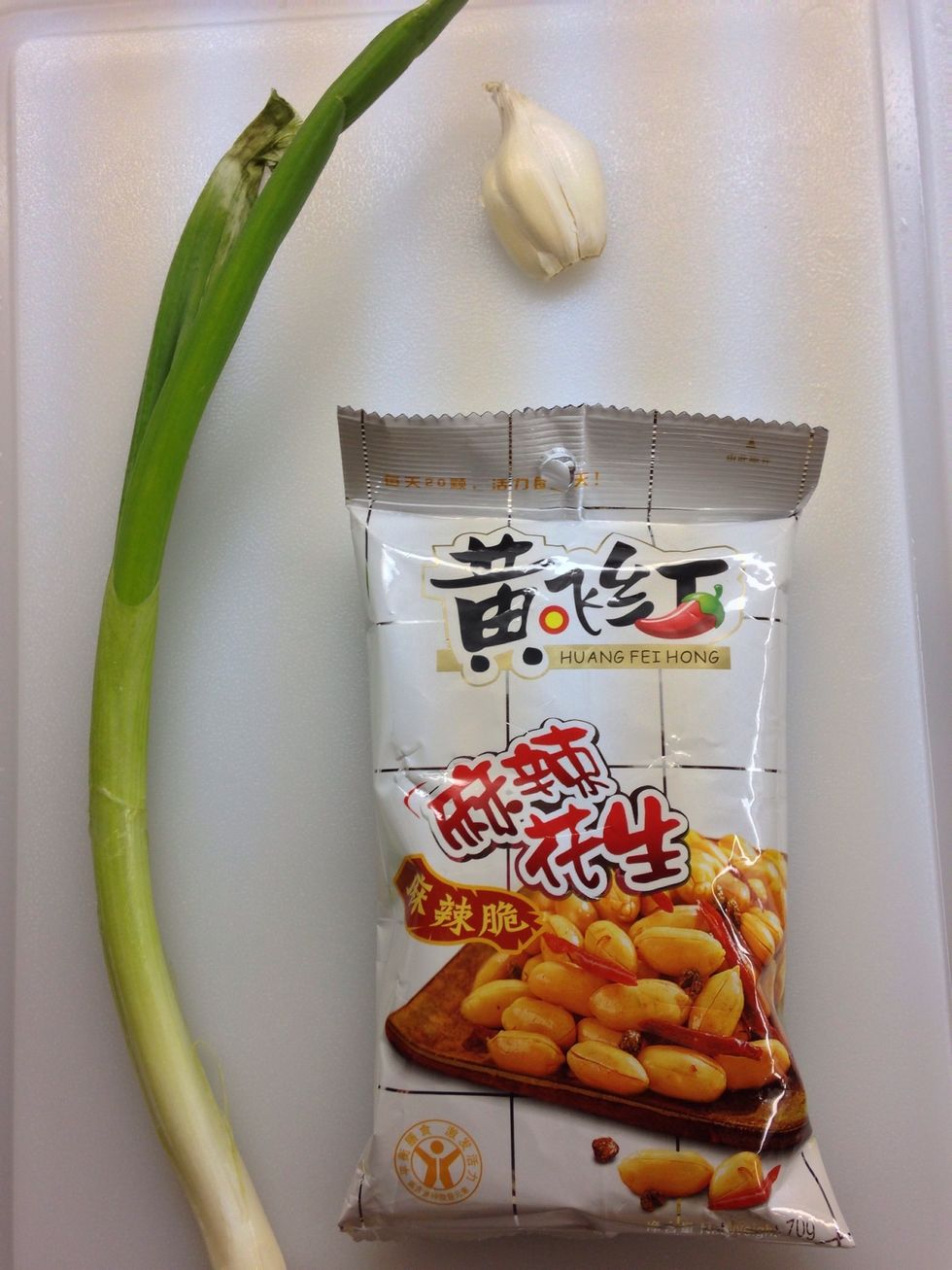 And here we have green onion, I clove of garlic and a bag of Chinese spicy peanut. Remember, you can get this bag of spicy peanut at most of the Chinese supermarket.