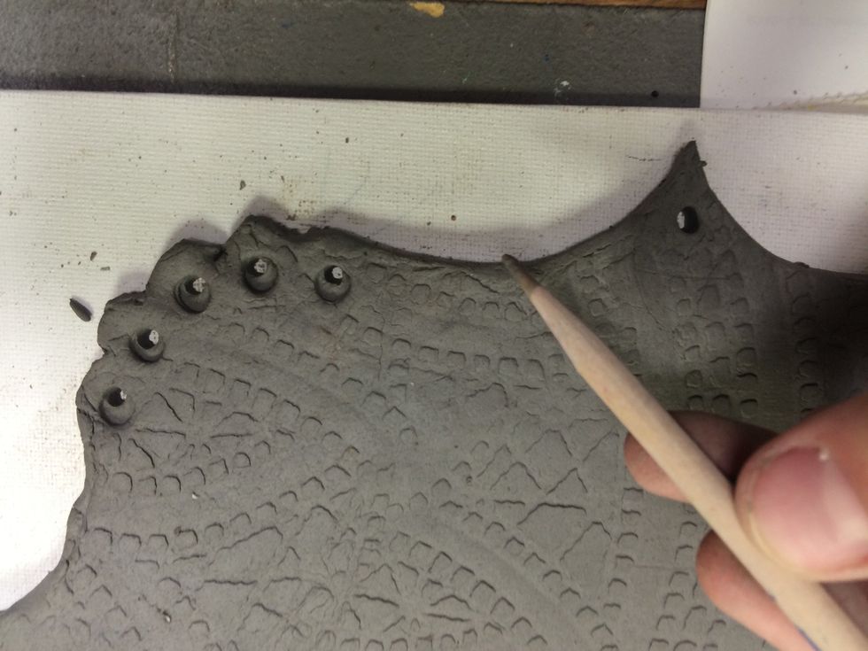 And holes at the bottom for hanging decorative beads.