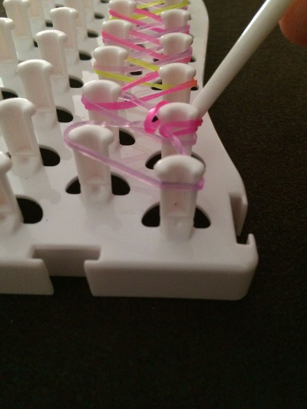 And hook it onto the third, then take off the first third elastic and put it on the fourth and so on