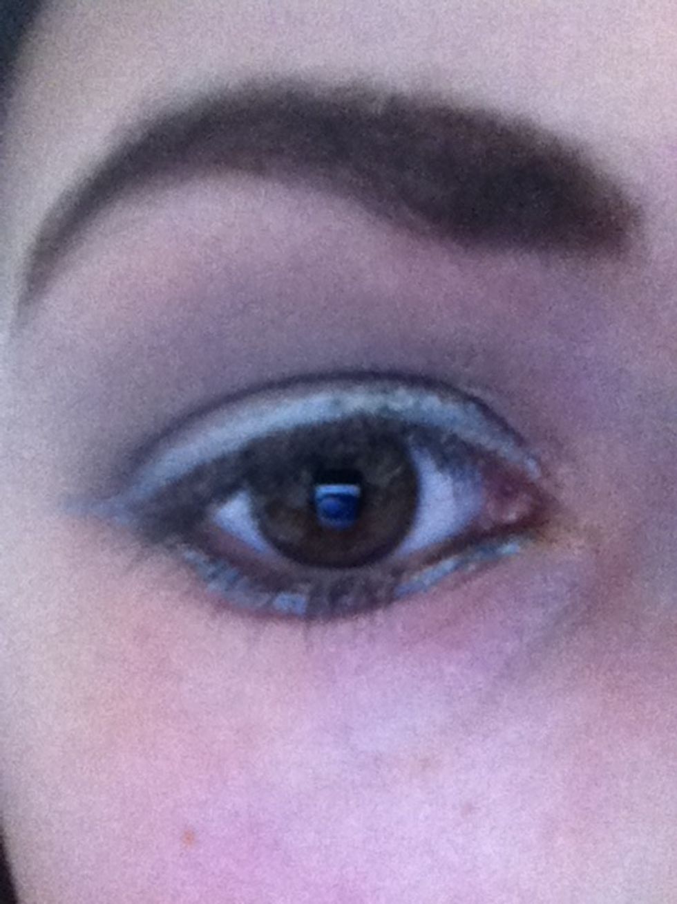 And if you want, you can line your bottom lash line as well with the silver eyeliner and join it up to the top line. Then add mascara or fake eyelashes.