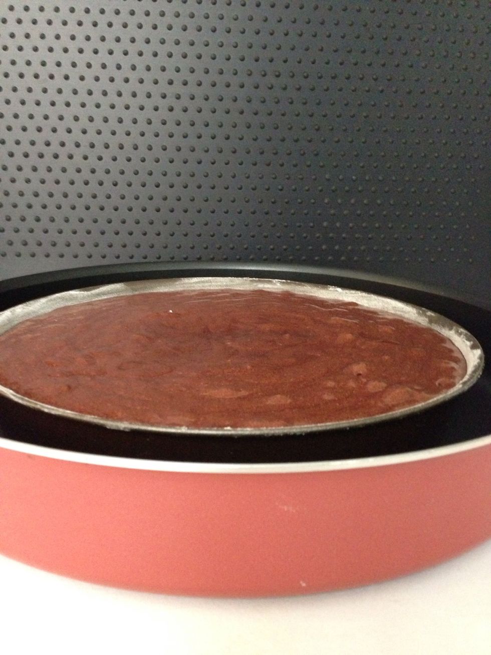 And in another tray to bake it in a water bath-Bain marie. If you still have some egg whites bits. Don't worry it is normal. Because mixing has to be quick and delicate