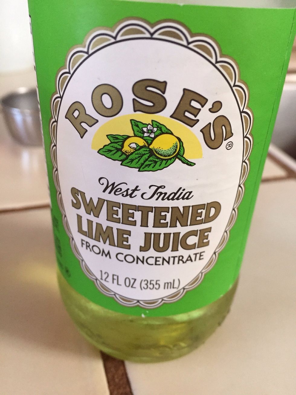 And lime juice, to a glass with ice, give a stir. (Can also combine all in martini shaker with ice, and shake up)