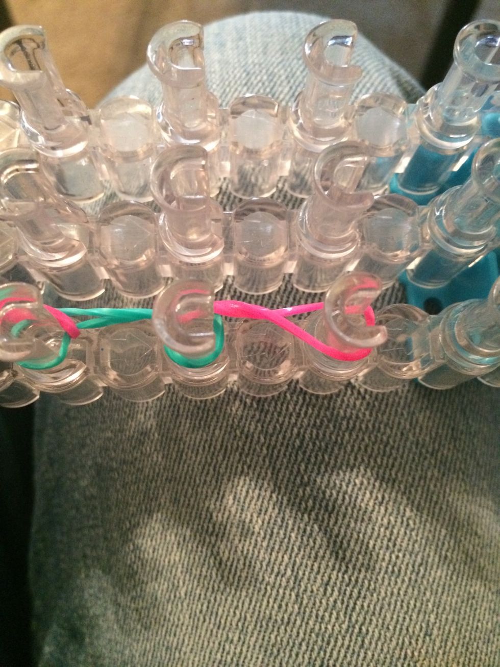 And loop the last part of the pink rubber band that is under the blue band. Or which ever color band you picked.