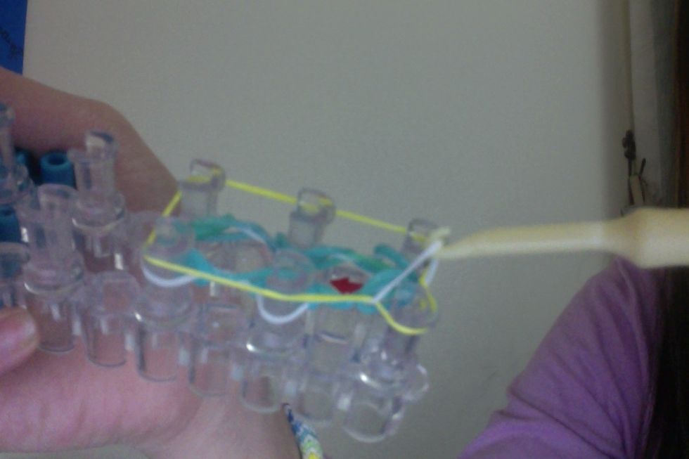 And loop the six bottom corners clockwise over the top (yellow) band.