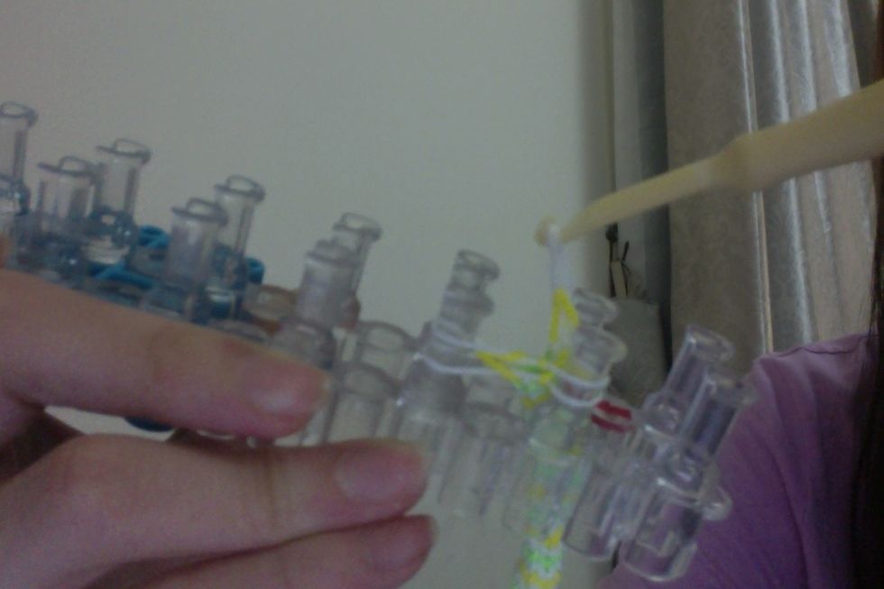 and loop them over to the farthest left peg. Like so.