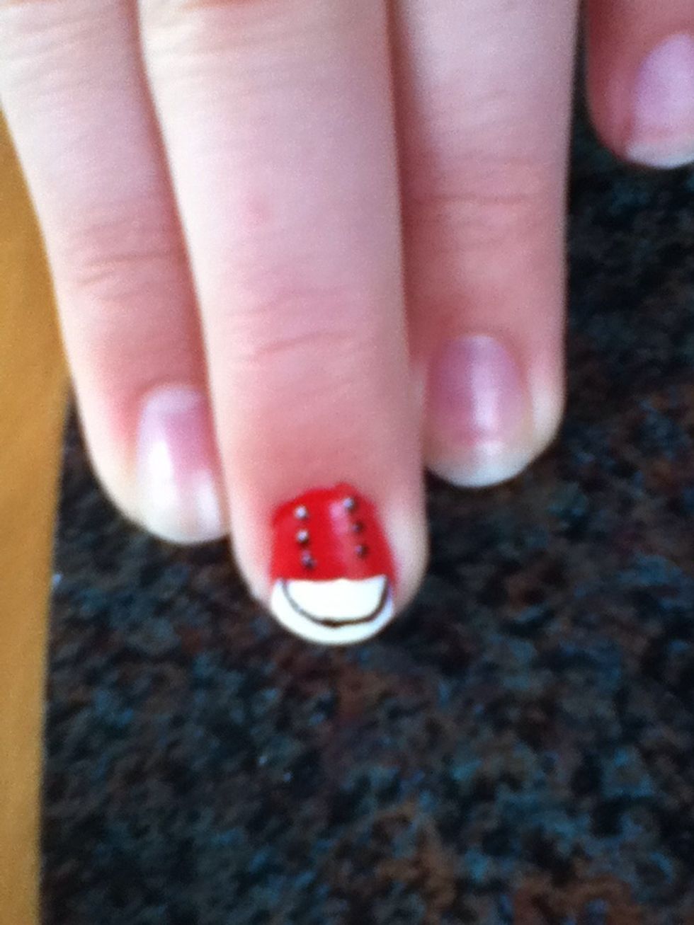 And now add a black line around the top the nail