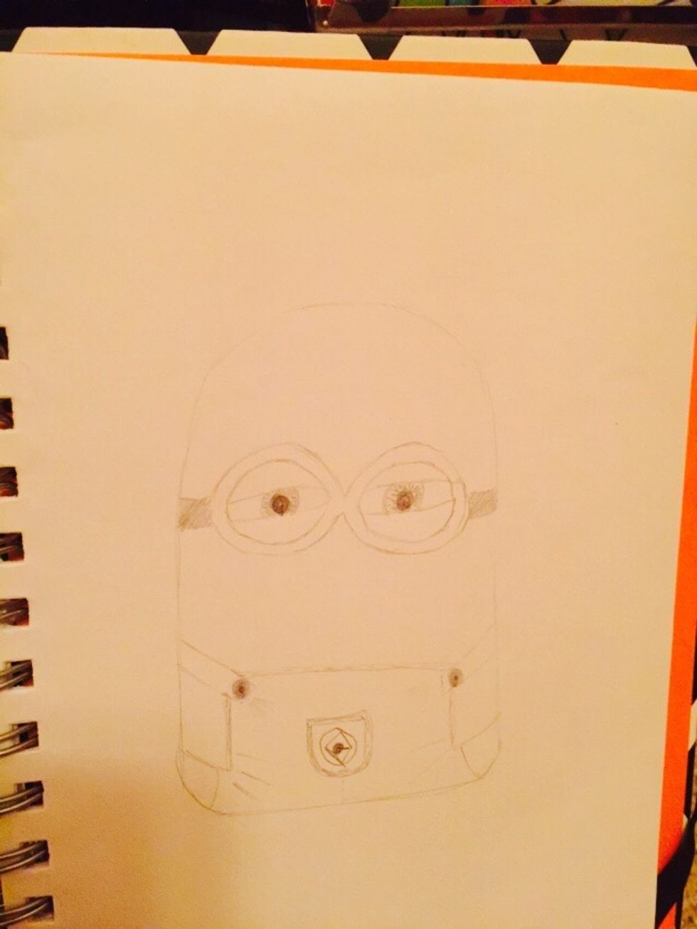 And now add the eyes in the goggles (I've drawn my eyes squinty to make the minion look naughty )