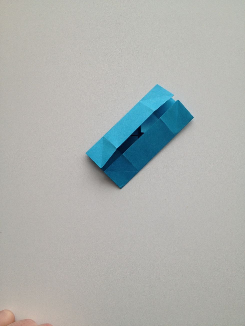 And now fold the other two sides to the center.