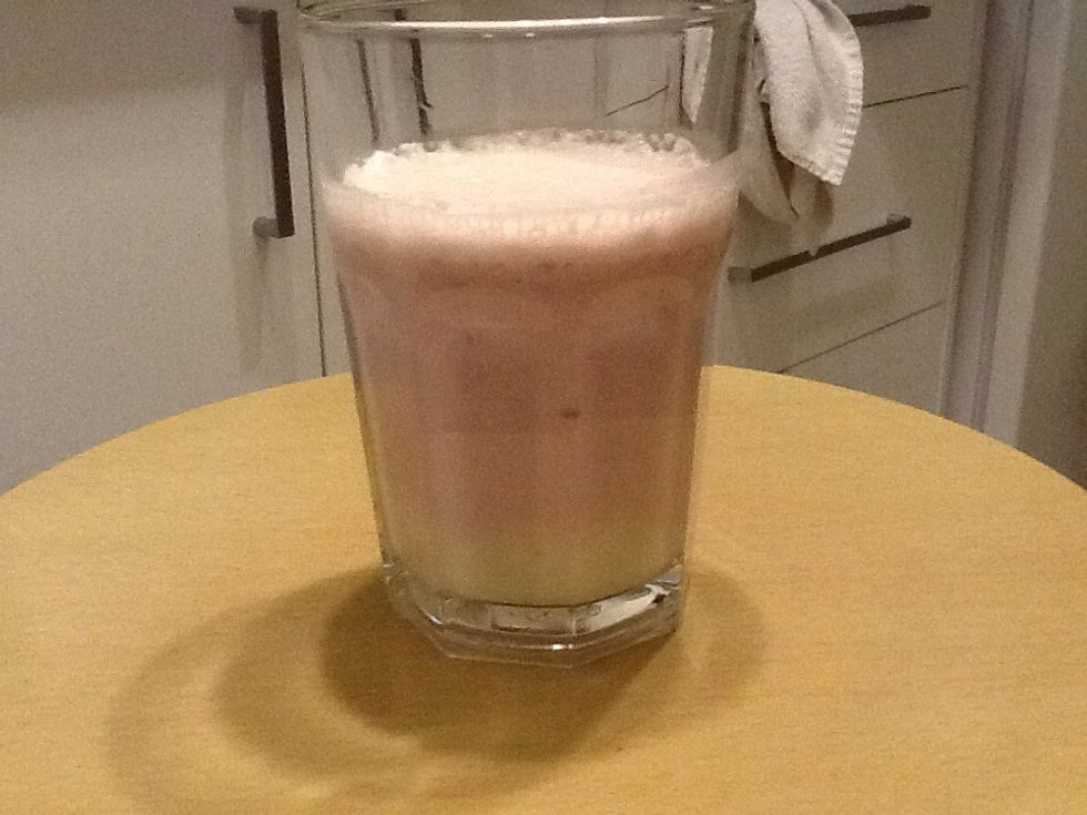 And now pour the yellow one in a cup and slowly pour the other pink one in.