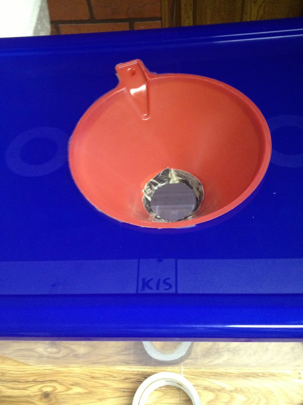 And now we're ready to make the baffles which will hold the lamp over the opening. Get out your styrofoam, cutter, and screwdriver. Don't attach the funnel to the lid just yet. That will be at the end