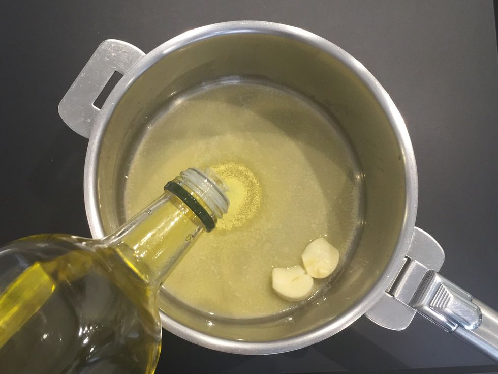 And olive oil. When garlic is fragrant you can discard or keep till the end.