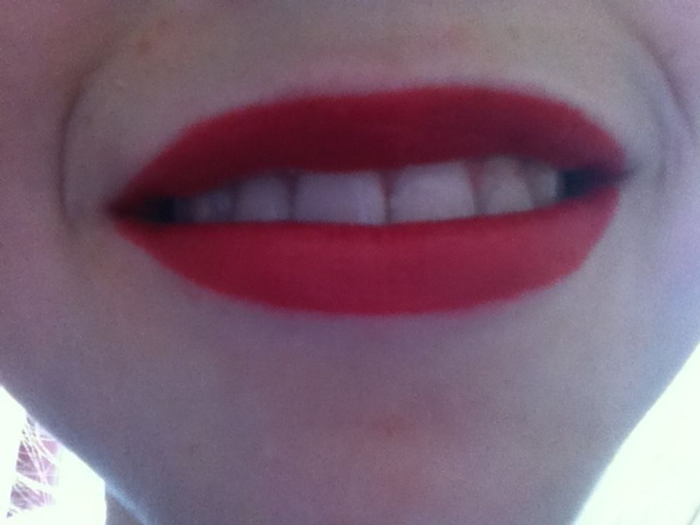 And on your lips, add bright red lipstick for a finishing touch!