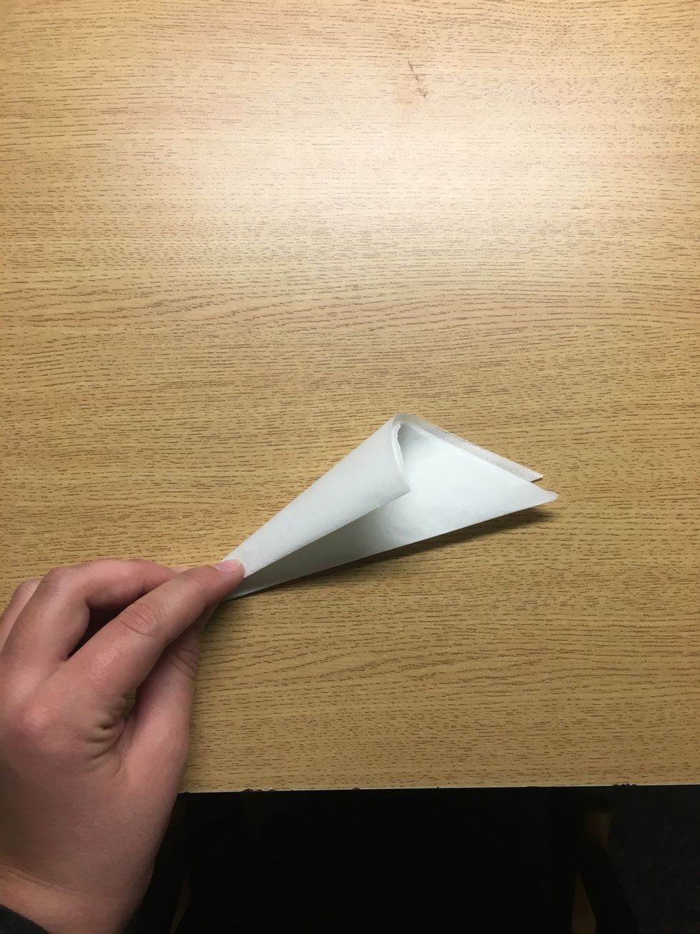 And one more. On my last fold, instead of folding the triangle in half I like to fold this way. This makes it easier to make a circle.