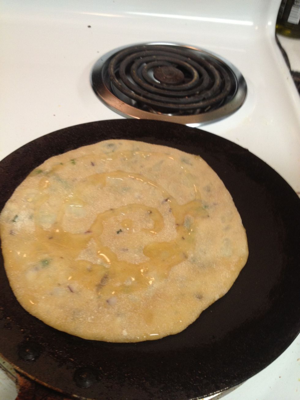 and over it. As long as you put oil on both the sides it's good. Put oil on 1 side flip and put oil on the other side.