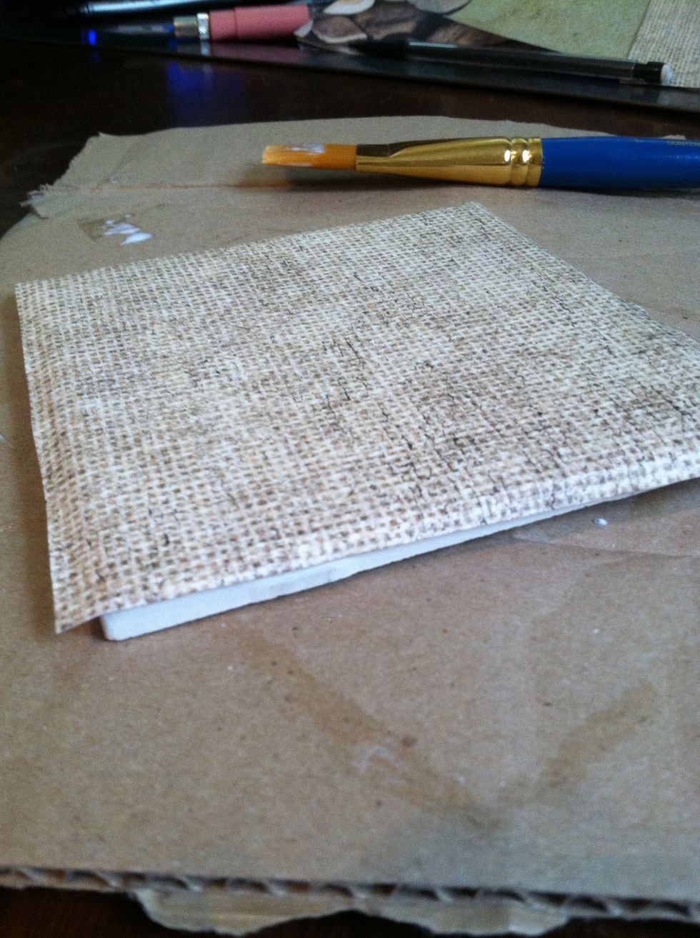 ...and place it on the tile. The paper should hang over all four edges.