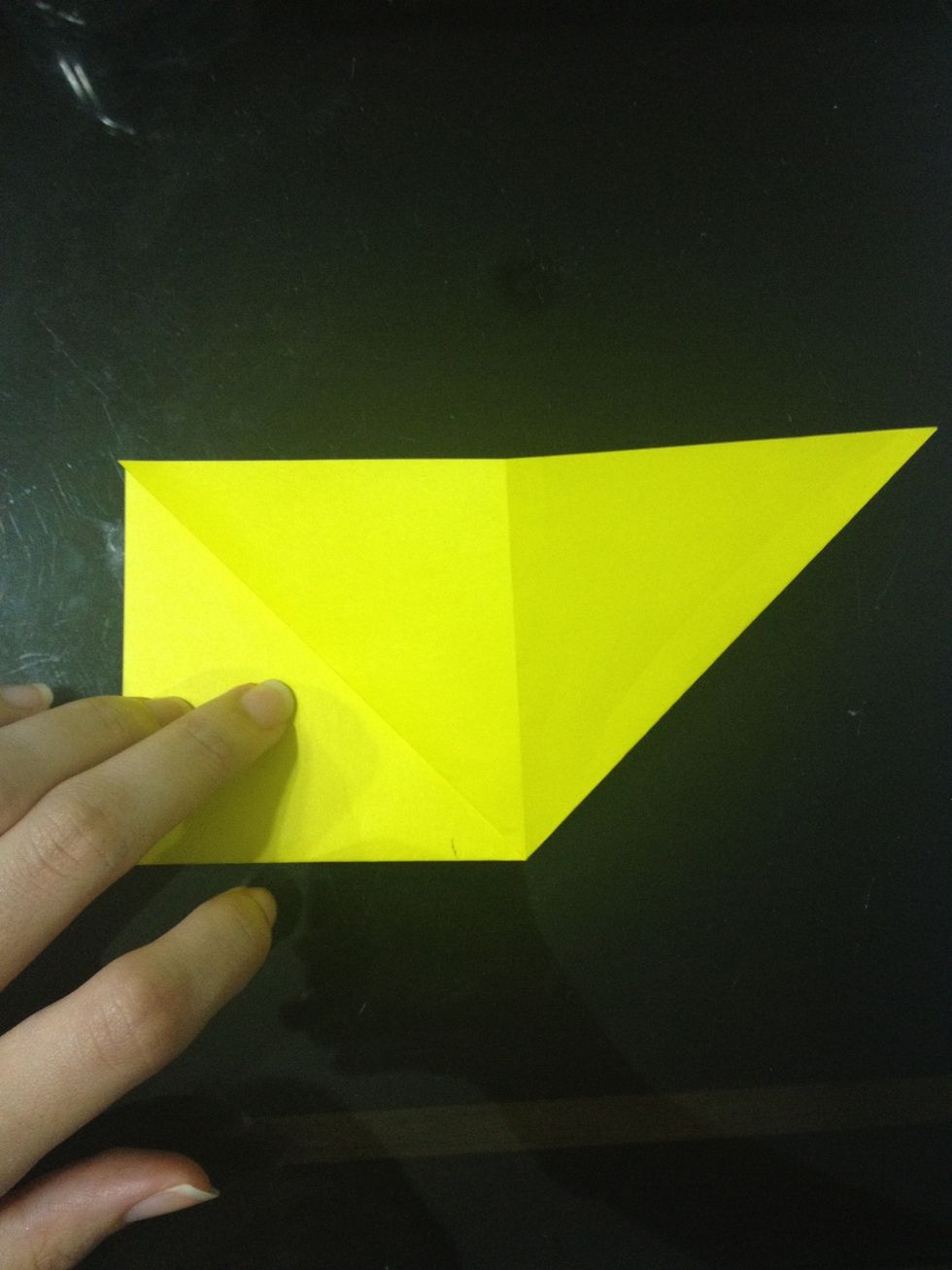 And press down to get a triangle. Flip it over and repeat on the other side.