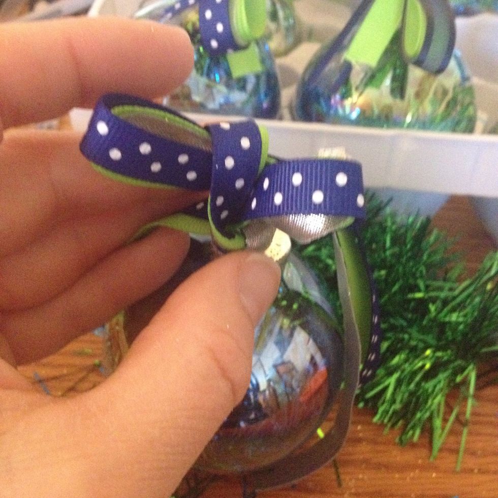 And pull the other loop out so it looks like a bow.