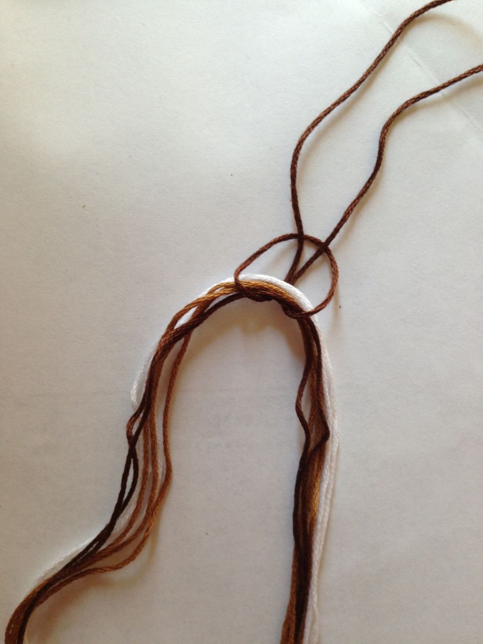 ... and pull the two strings through it.