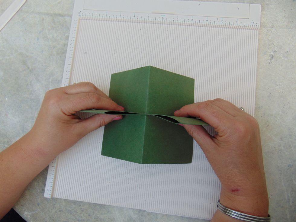 .... and pull them away from each other so you are then folding the card the other way....