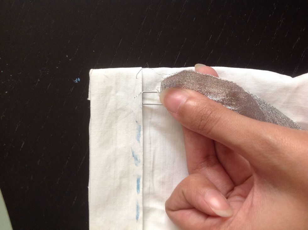 And put it through the place you had left un stitched.