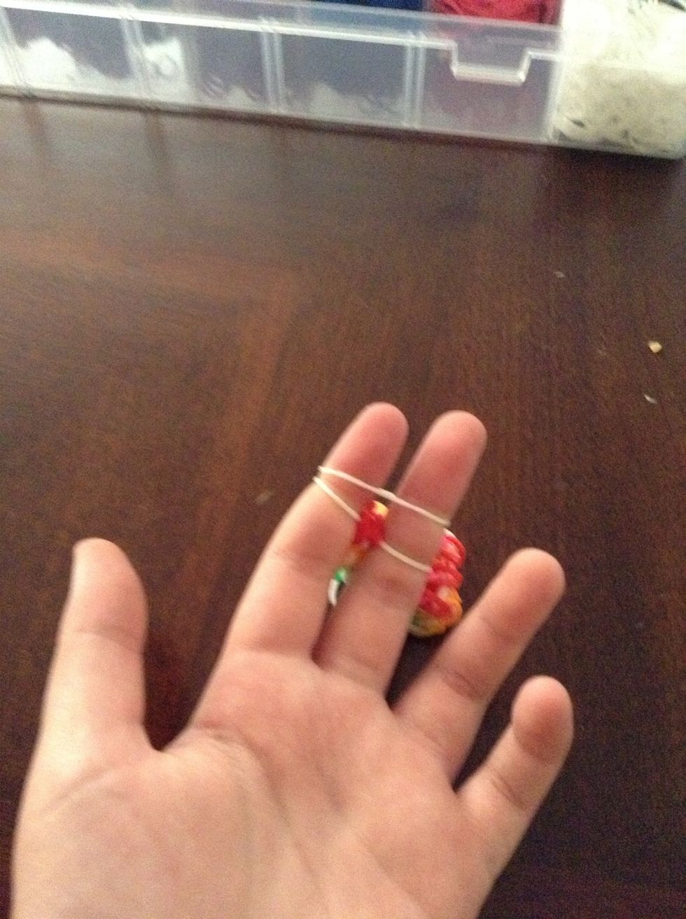 And put the red bands in the middle of the white band. Now add another white band