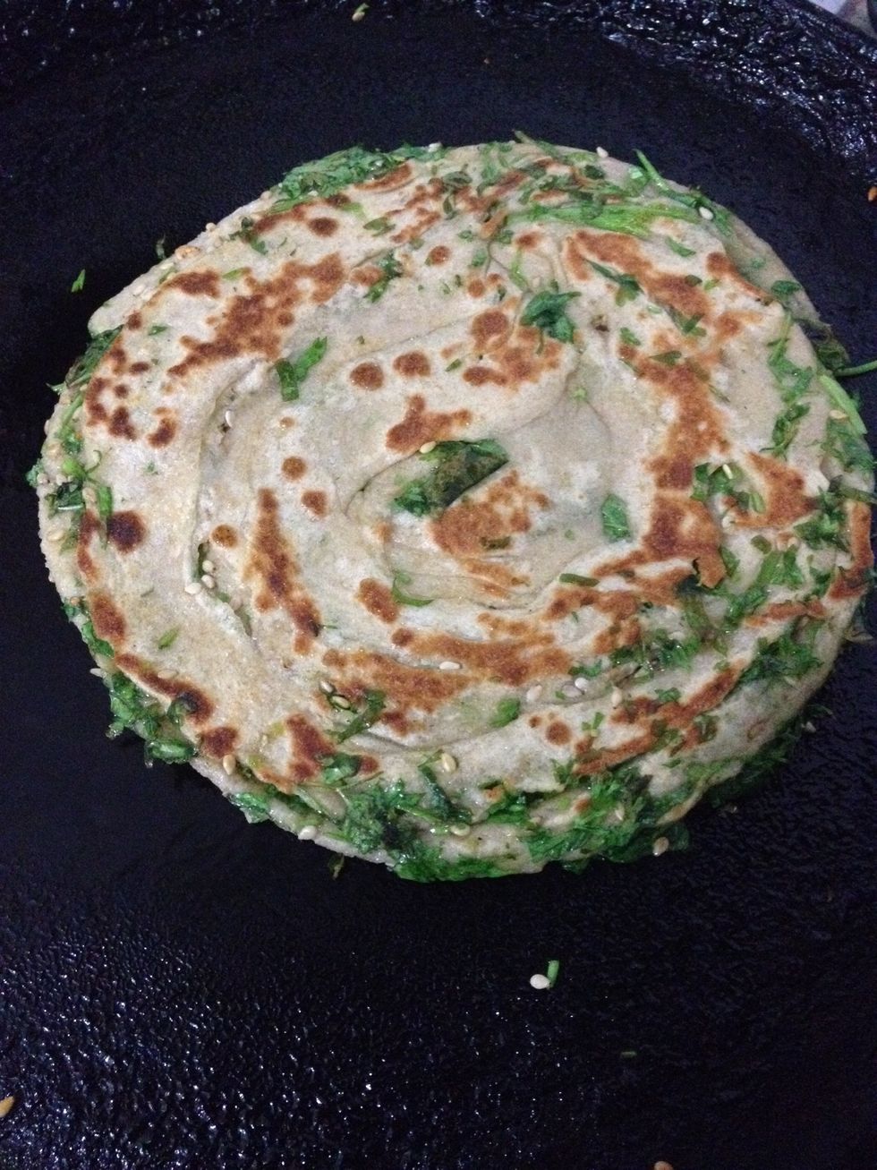 And roast it by adding bit of oil on either side and pressing slighly using the back of spoon . So all the layers come to life