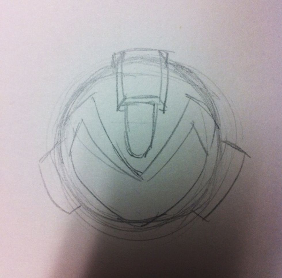 And sketch rough megaman's head on the circle.