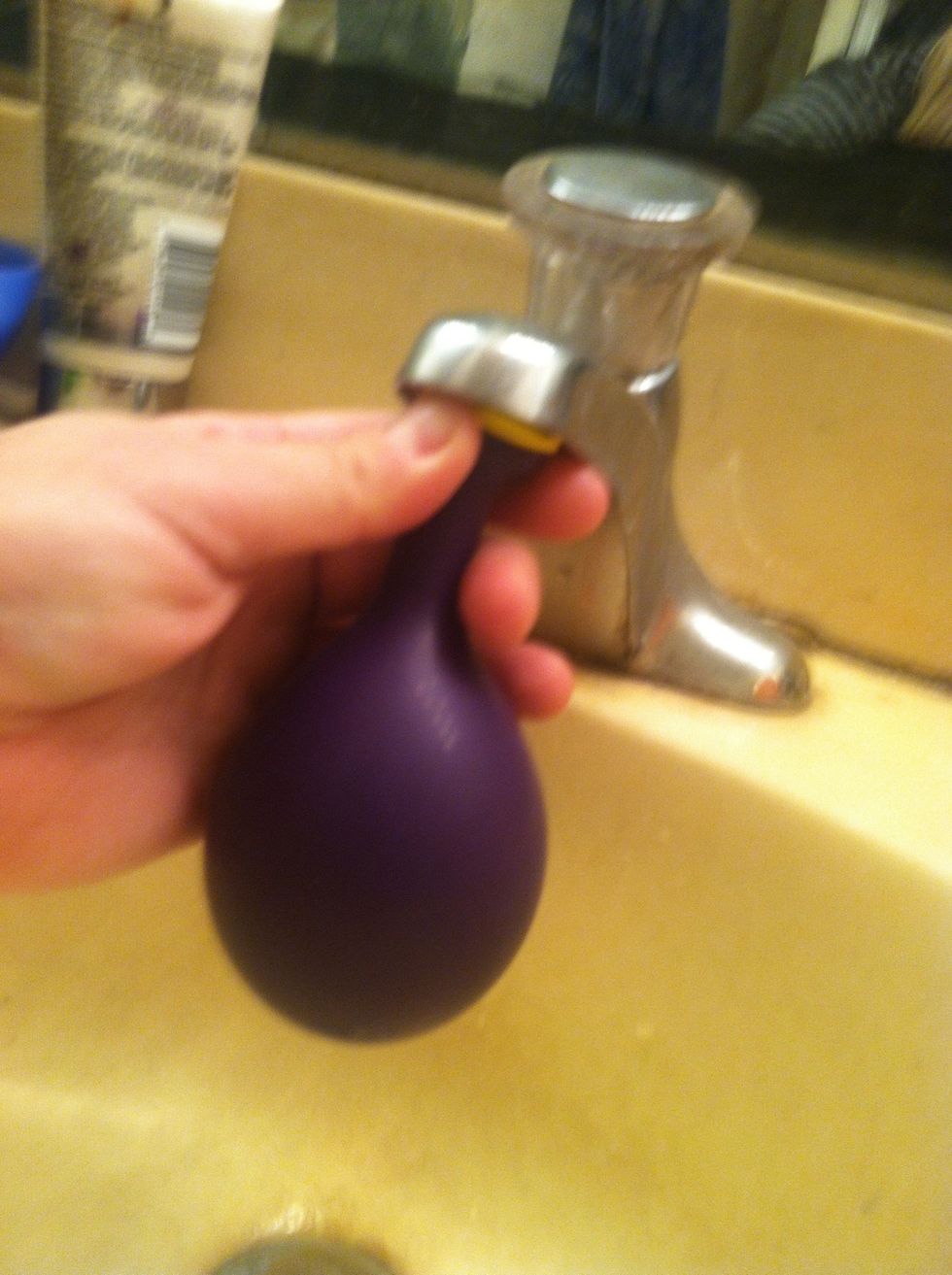 And slowly fill the balloon until the bowl of the balloon is just stretching out.