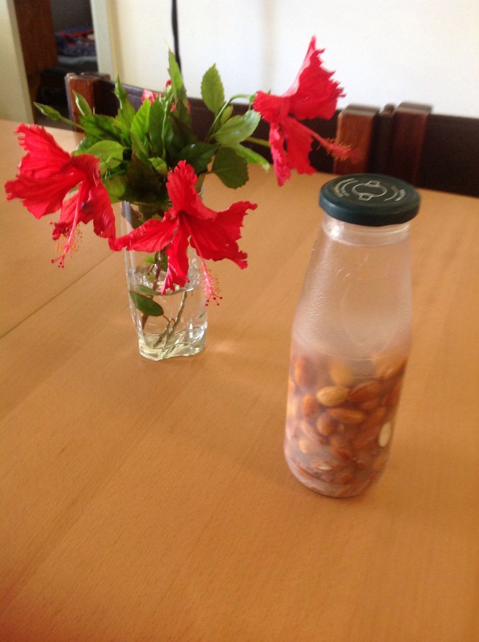 ...and soak them in a litre of water (preferably filtered) overnight, in the fridge. The almonds will swell and release their juices.