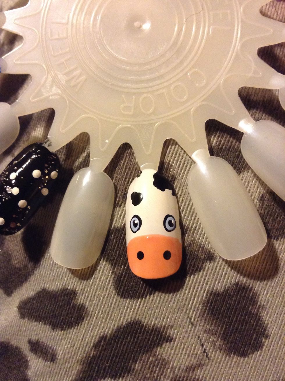 And some super tiny white dots in the corners of the black, I would advise using the tip of a tooth pick and very little polish to get small enough white