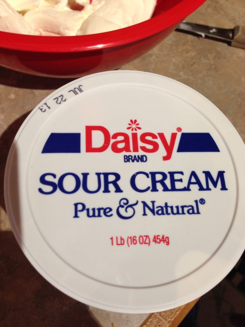 And sour cream. Use a hand held blender to mix! Now the mixture of cream cheese, mayo, and sour cream. Add your garlic  and salt & pepper to taste!