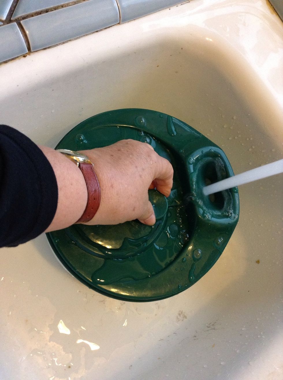 . . . And spin away! As water goes in you spin it out and clean your spinach as you go.