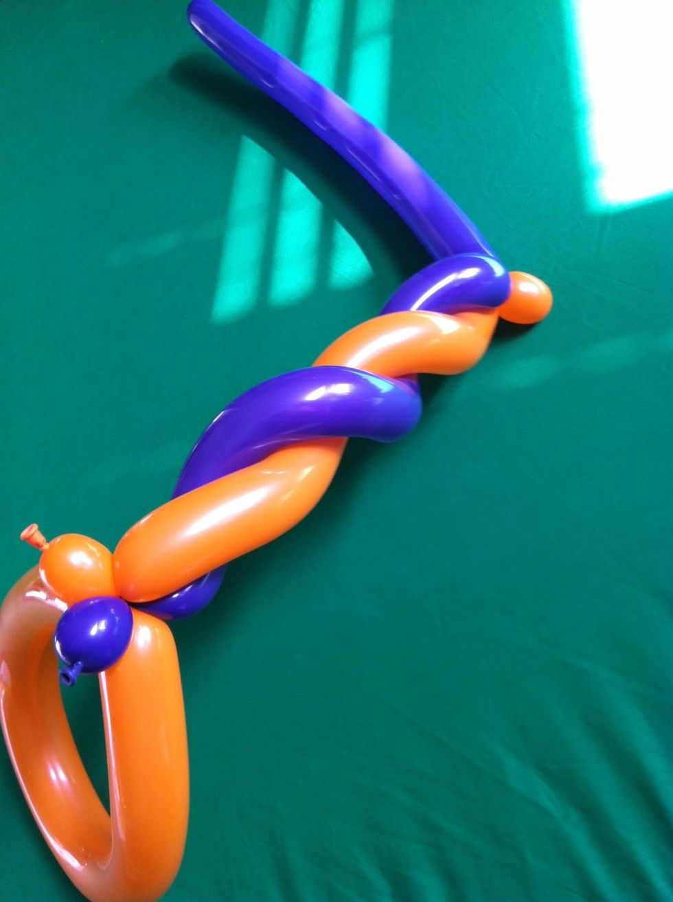 And spiral them together, squeezing and twisting together at the top to connect them