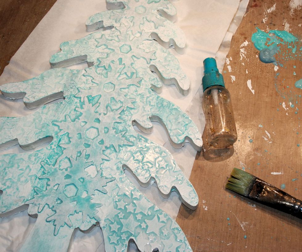 ....and spray(before it's dry) with water and let it flow. Dry with the heatgun. Do all the steps also at the back.